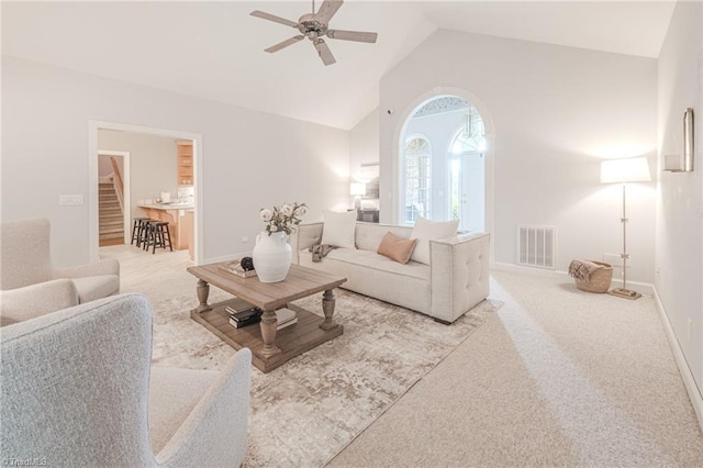 2809 Churchill Ct, High Point, NC 27262 - living area featuring ceiling fan, carpet, high vaulted ceiling, baseboards, and arched walkways