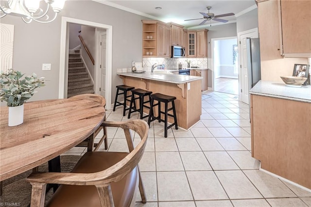 2809 Churchill Ct, High Point, NC 27262 - kitchen with stainless steel microwave, open shelves, a kitchen breakfast bar, a peninsula, and crown molding