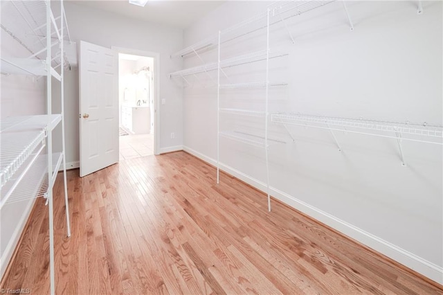 2809 Churchill Ct, High Point, NC 27262 - spacious closet featuring wood finished floors