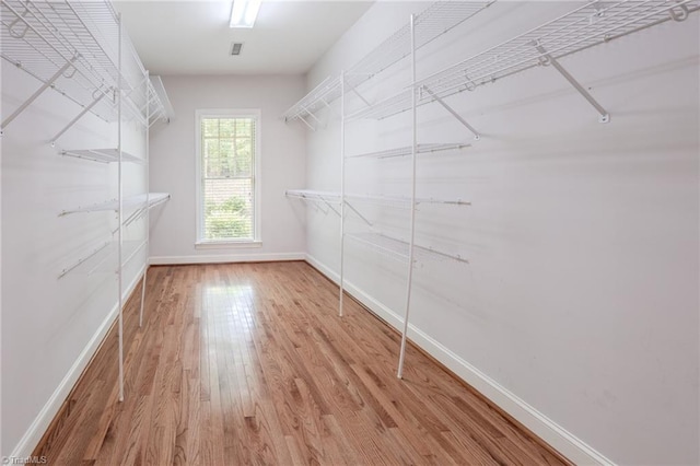 2809 Churchill Ct, High Point, NC 27262 - walk in closet with wood finished floors