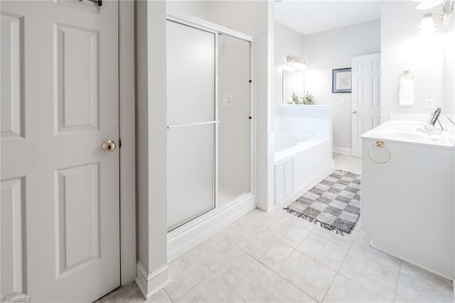 2809 Churchill Ct, High Point, NC 27262 - bathroom with a stall shower, vanity, a bath, and tile patterned flooring