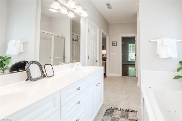 2809 Churchill Ct, High Point, NC 27262 - bathroom featuring double vanity, a tub with jets, a shower stall, tile patterned floors, and baseboards