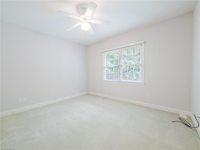 2809 Churchill Ct, High Point, NC 27262 - unfurnished room with light colored carpet, baseboards, and ceiling fan