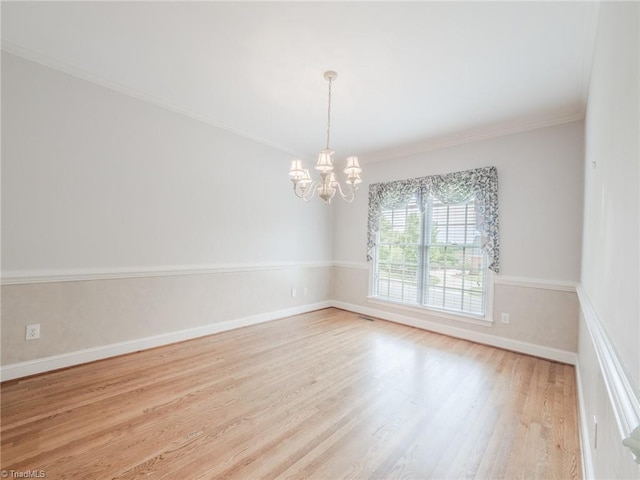 2809 Churchill Ct, High Point, NC 27262 - spare room with a chandelier, wood finished floors, ornamental molding, and baseboards