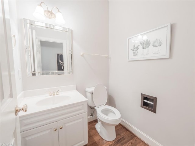2809 Churchill Ct, High Point, NC 27262 - bathroom featuring toilet, vanity, wood finished floors, and baseboards