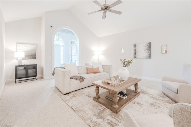 2809 Churchill Ct, High Point, NC 27262 - living room with carpet flooring, high vaulted ceiling, a ceiling fan, and baseboards
