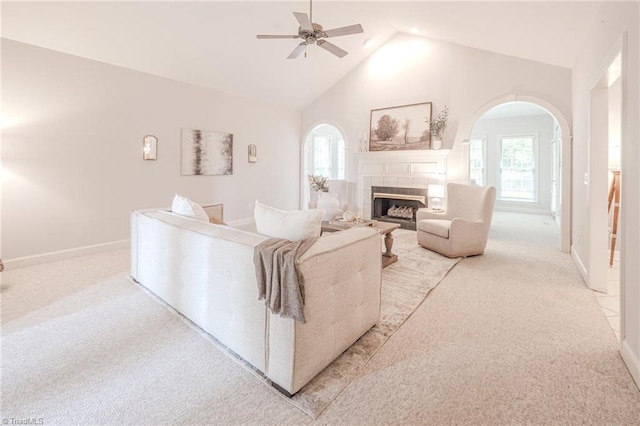 2809 Churchill Ct, High Point, NC 27262 - living area with light carpet, a ceiling fan, arched walkways, and high vaulted ceiling