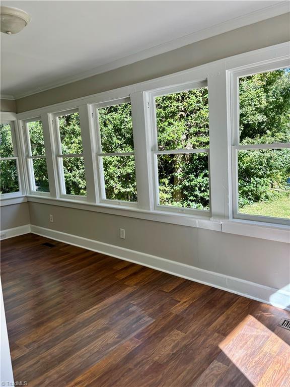 unfurnished sunroom with a wealth of natural light