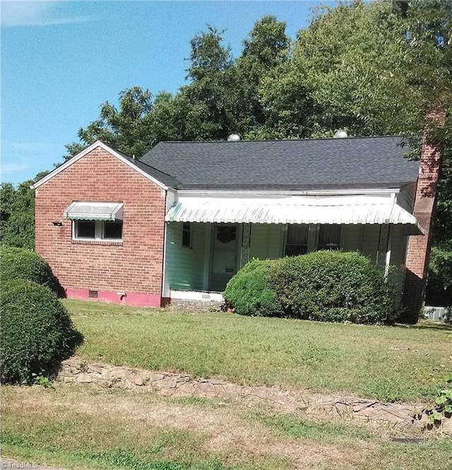 bungalow with a front lawn