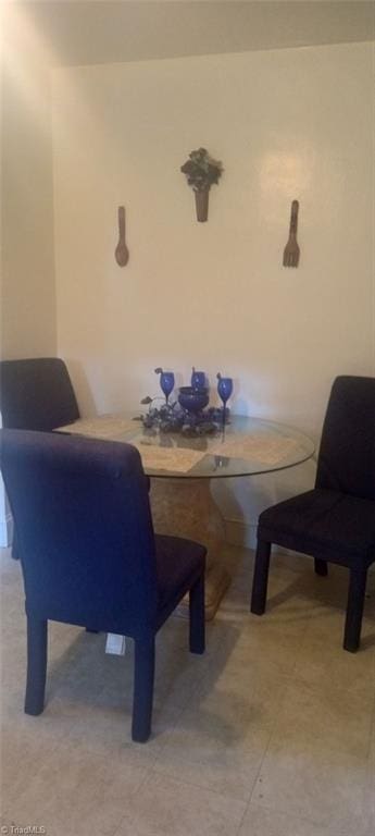 living area with light tile patterned floors