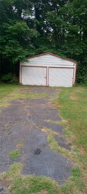 view of outbuilding featuring a garage