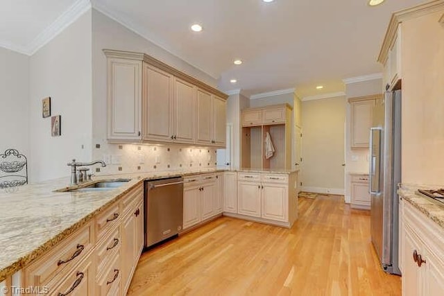 kitchen featuring a peninsula, light wood-style flooring, light stone counters, and appliances with stainless steel finishes