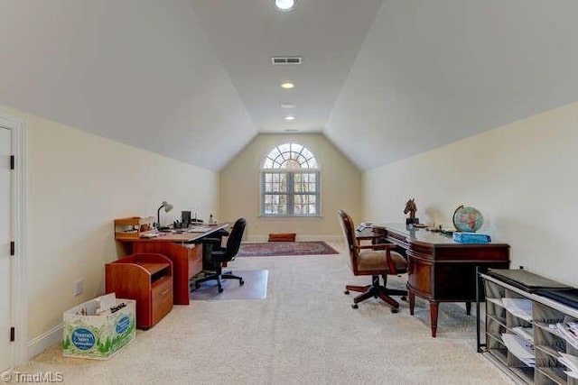 home office featuring lofted ceiling, baseboards, visible vents, and carpet floors