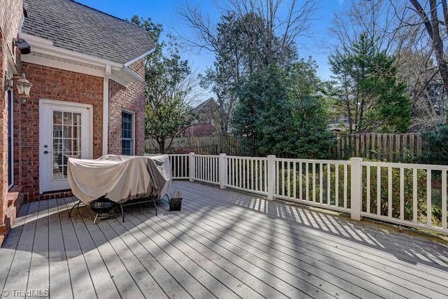 wooden terrace with grilling area and fence