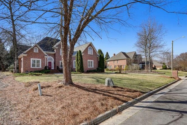 view of front facade with a front lawn and crawl space