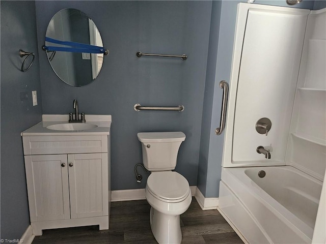 full bathroom featuring toilet, vanity, bathing tub / shower combination, and hardwood / wood-style flooring