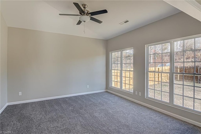 empty room featuring carpet flooring and ceiling fan