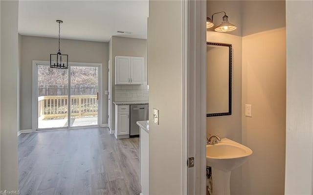 bathroom featuring tasteful backsplash and hardwood / wood-style flooring