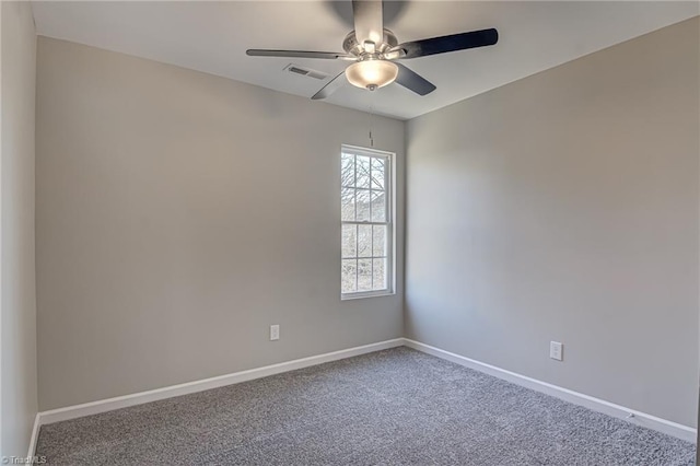 carpeted empty room featuring ceiling fan