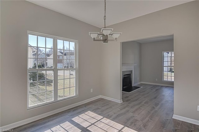 interior space featuring hardwood / wood-style floors and a notable chandelier