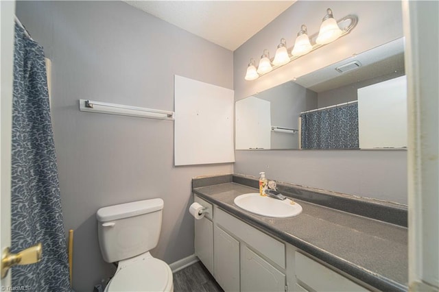 full bath with vanity, toilet, wood finished floors, and a shower with shower curtain