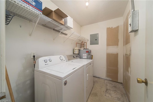 clothes washing area with electric panel, washer and clothes dryer, and water heater