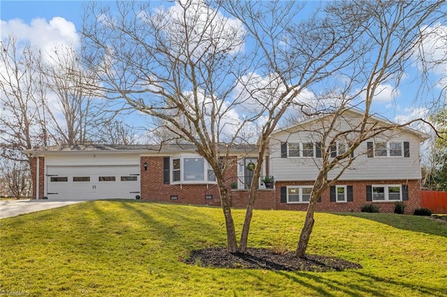 tri-level home featuring a garage and a front yard