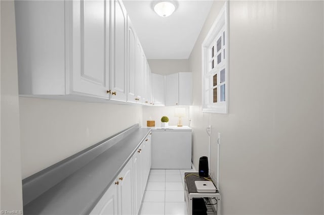 interior space with white cabinetry and light tile patterned floors