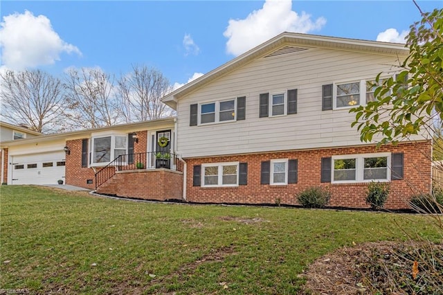 split level home with a garage and a front lawn