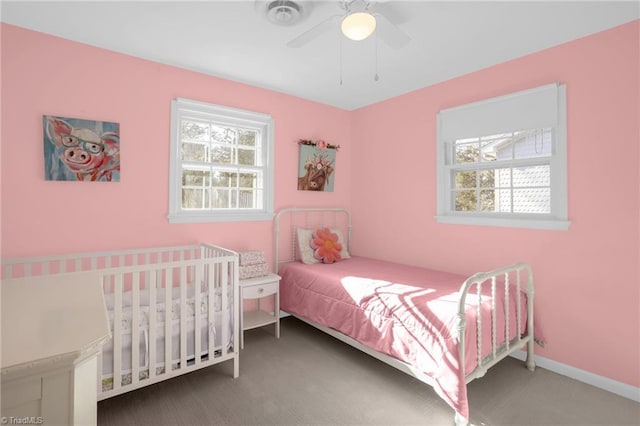 bedroom featuring multiple windows, carpet floors, and ceiling fan