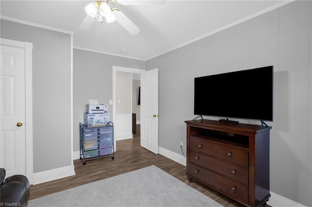 bedroom featuring dark hardwood / wood-style flooring, ornamental molding, and ceiling fan