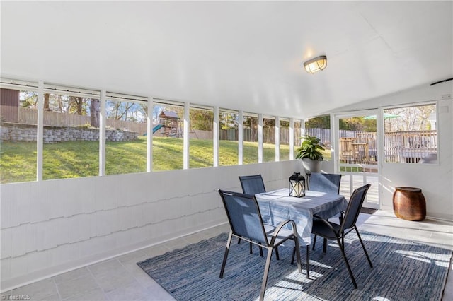 sunroom / solarium with vaulted ceiling