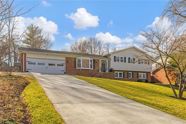 tri-level home featuring a garage and a front yard