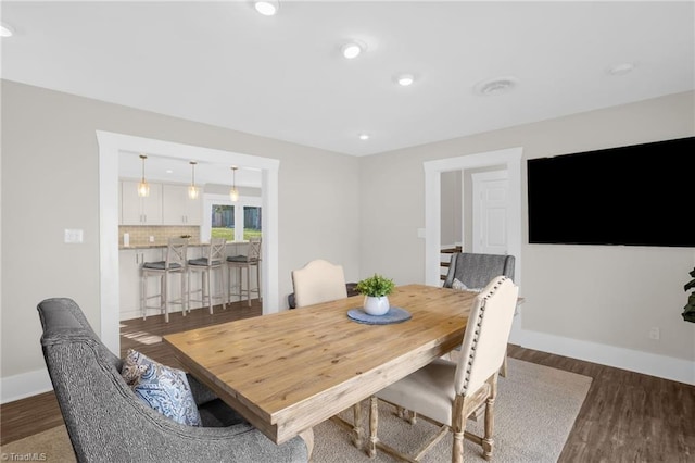 dining room with dark wood-type flooring