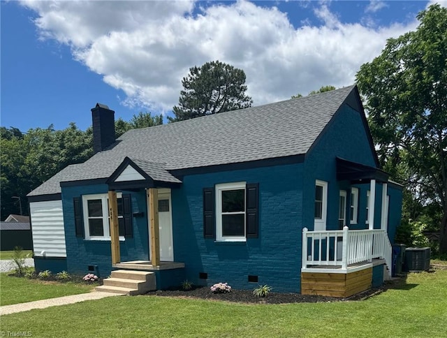 408 N Maple St, Graham, NC 27253 - view of front of house featuring crawl space, roof with shingles, a front yard, a chimney, and central AC