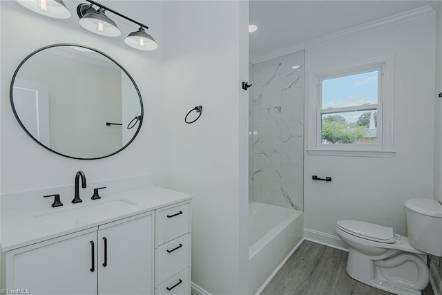 408 N Maple St, Graham, NC 27253 - bathroom with toilet, vanity, crown molding, baseboards, and wood finished floors