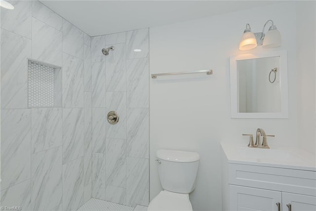 408 N Maple St, Graham, NC 27253 - full bath featuring vanity, toilet, and a tile shower