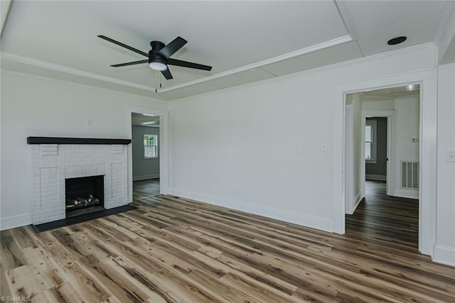 408 N Maple St, Graham, NC 27253 - unfurnished living room with ornamental molding, a ceiling fan, wood finished floors, baseboards, and a fireplace