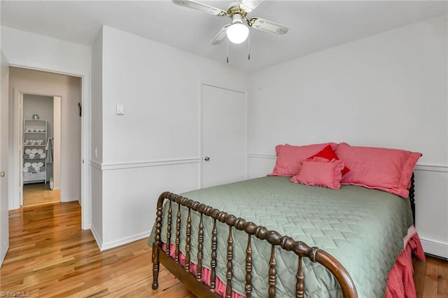 bedroom with hardwood / wood-style flooring and ceiling fan