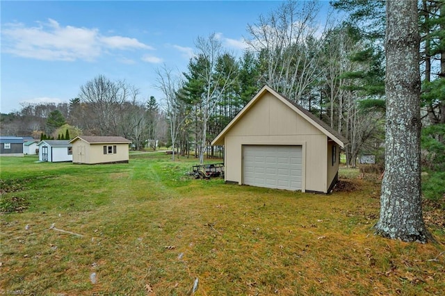 view of yard with an outbuilding and a garage