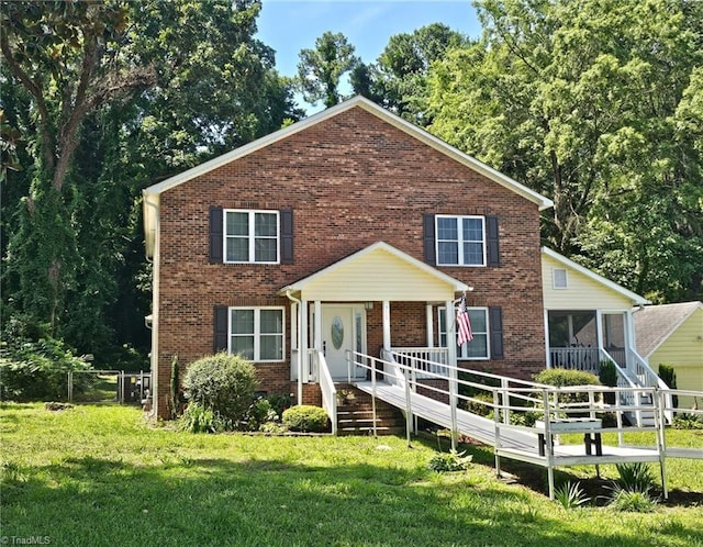 711 E Sunrise Ave, Thomasville, NC 27360 - traditional-style home featuring brick siding and a sunroom