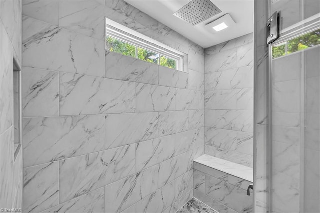 bathroom featuring tiled shower