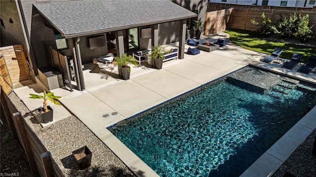 view of swimming pool featuring a patio area