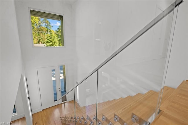 staircase with wood-type flooring