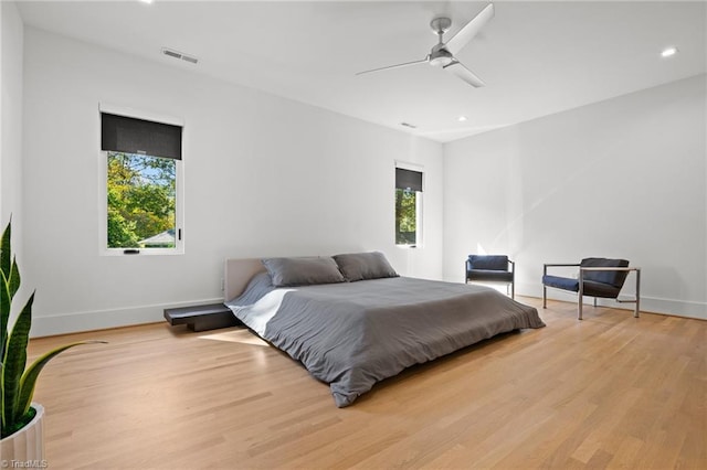 bedroom featuring ceiling fan and light wood-type flooring