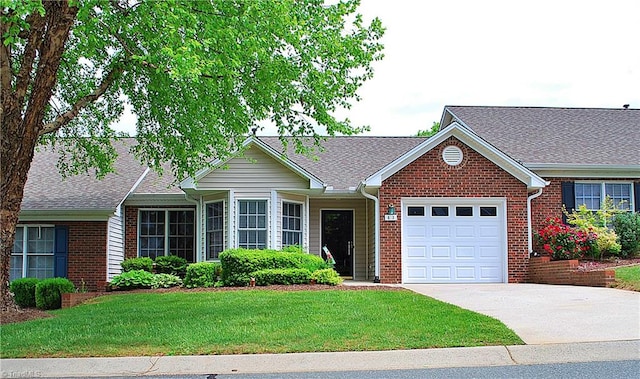 single story home with an attached garage, concrete driveway, brick siding, and a front lawn