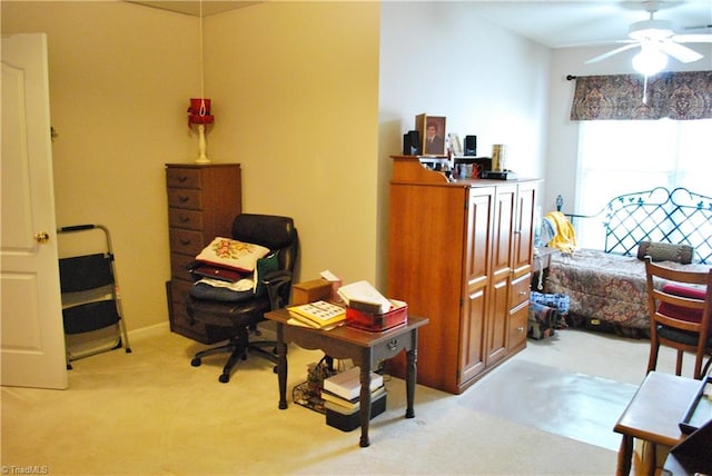 sitting room with ceiling fan and light carpet