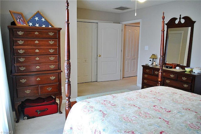 bedroom featuring carpet floors, a closet, and visible vents