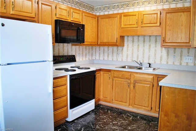 kitchen featuring a sink, freestanding refrigerator, electric range oven, light countertops, and black microwave