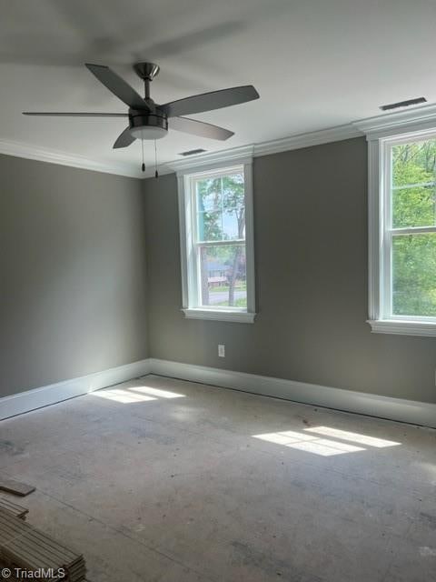 empty room featuring crown molding and ceiling fan